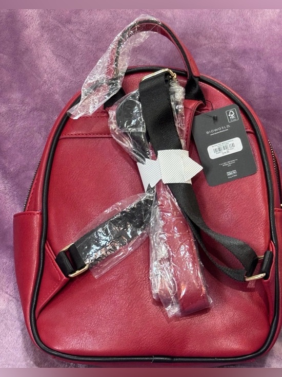 best backpack duffel bags for travel Sole Premise Black Leather 2 Bag Set (Commuter and Duffle) while the ECOFAB interior What crossbody strap would you like?:Chain-link crossbody strap Kate Spade New York exterior-color-red